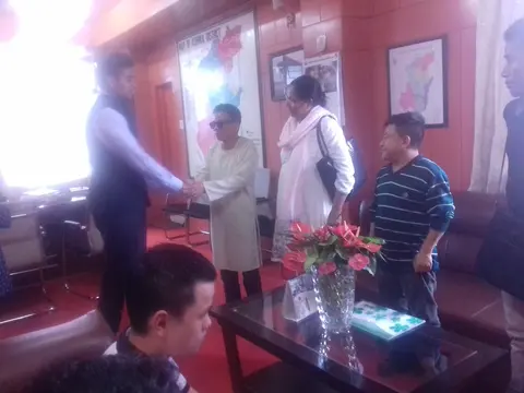 Amos  shaking hands with the DC of Kohima,, 2017
